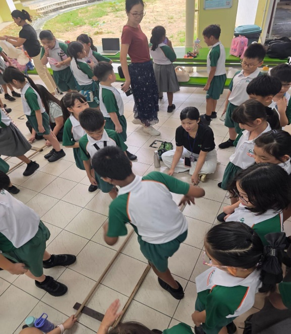 Students participating in a movement-based team challenge